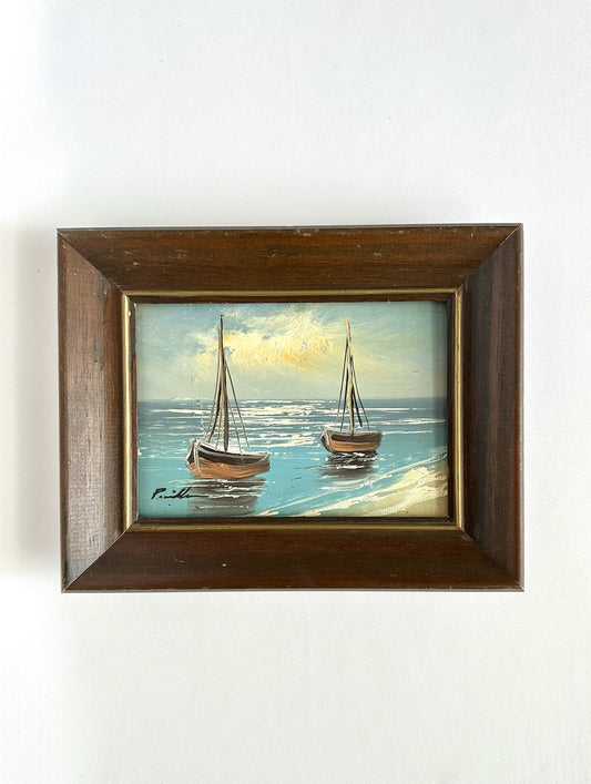 original  framed oil on board with two sailboats and a shoreline. artist signed