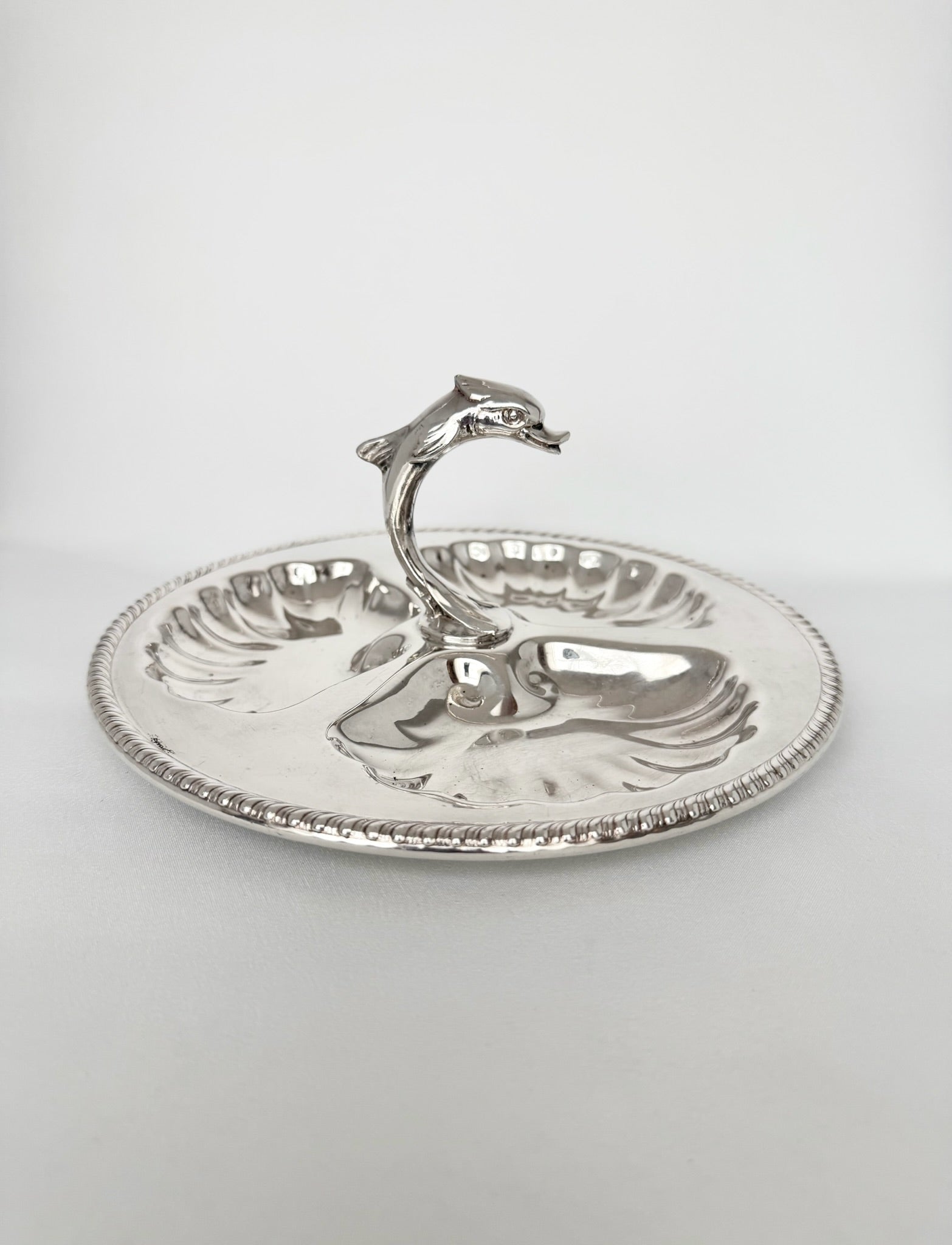 vintage silverplate seashell server with center dolphin handle