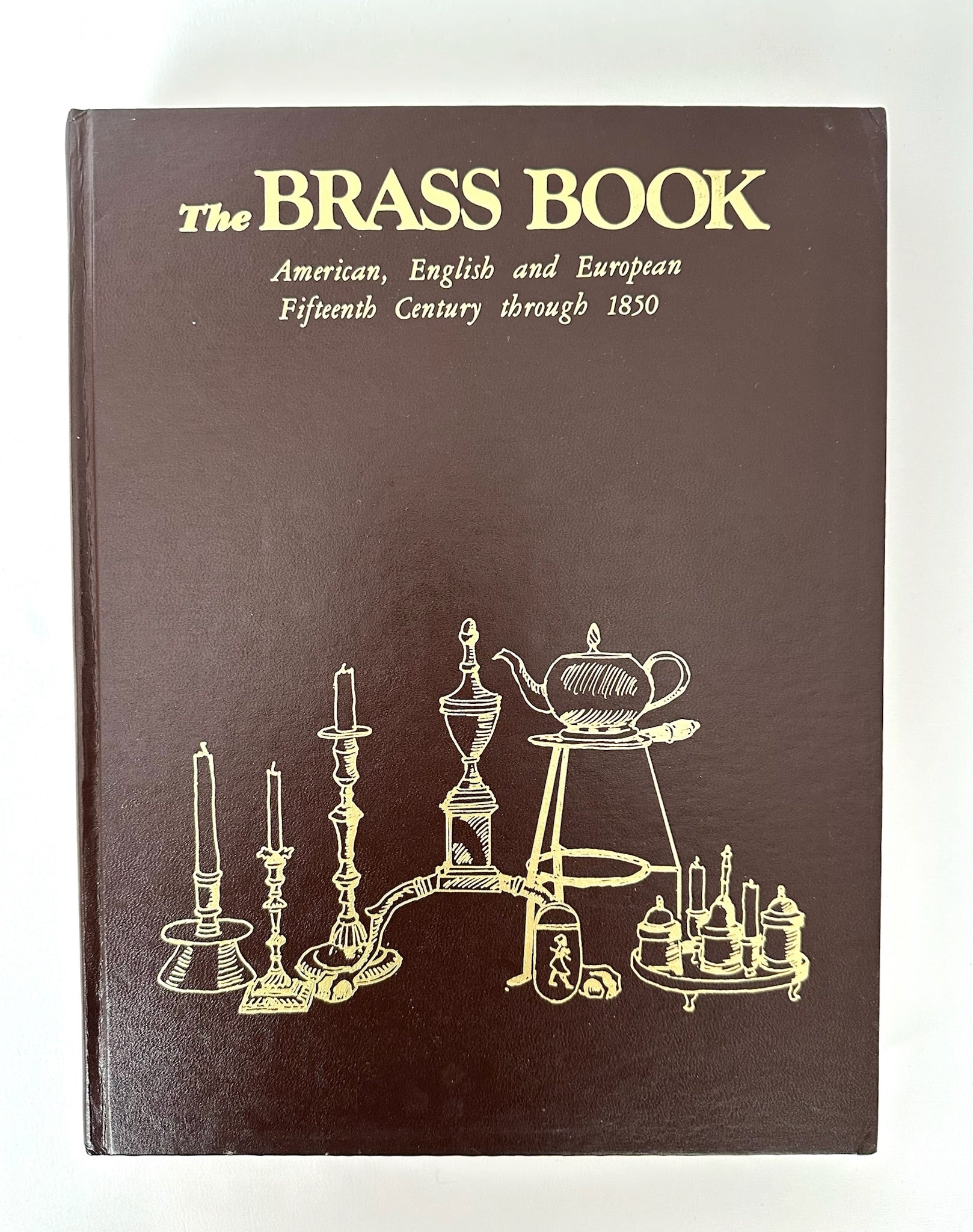 Vintage coffee table reference book about brass objects