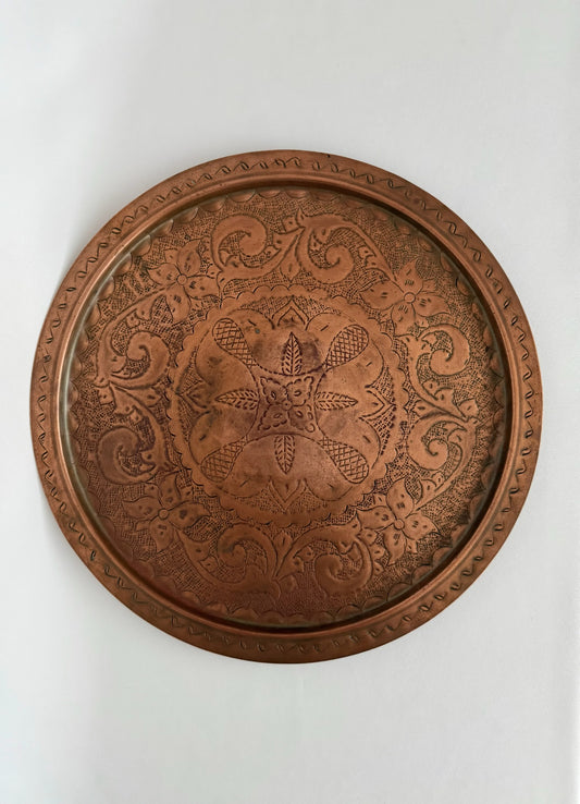 Vintage large round engraved copper serving tray.