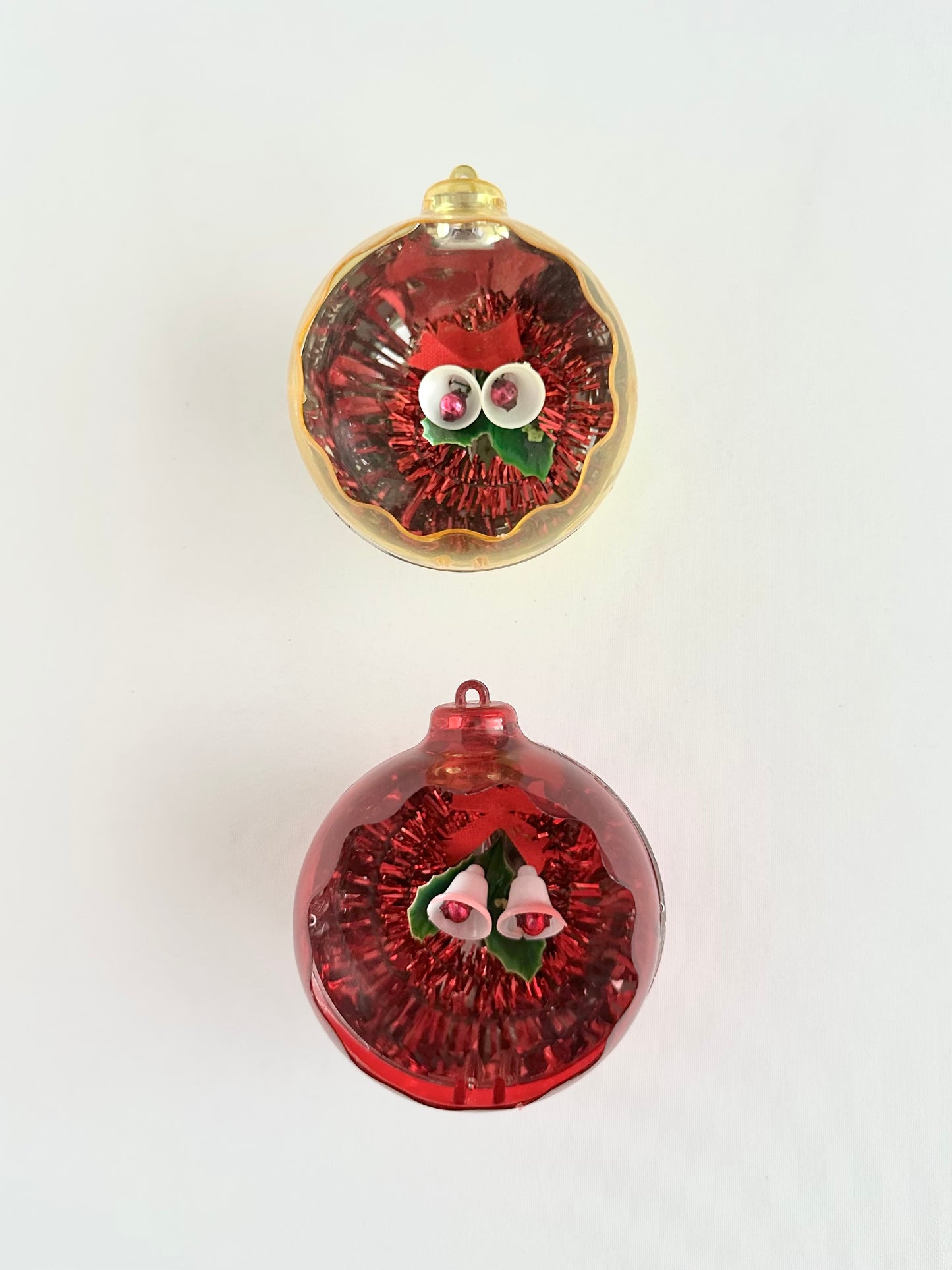Vintage plastic Jewel Brite diorama christmas tree ornaments set of two in red and yellow.