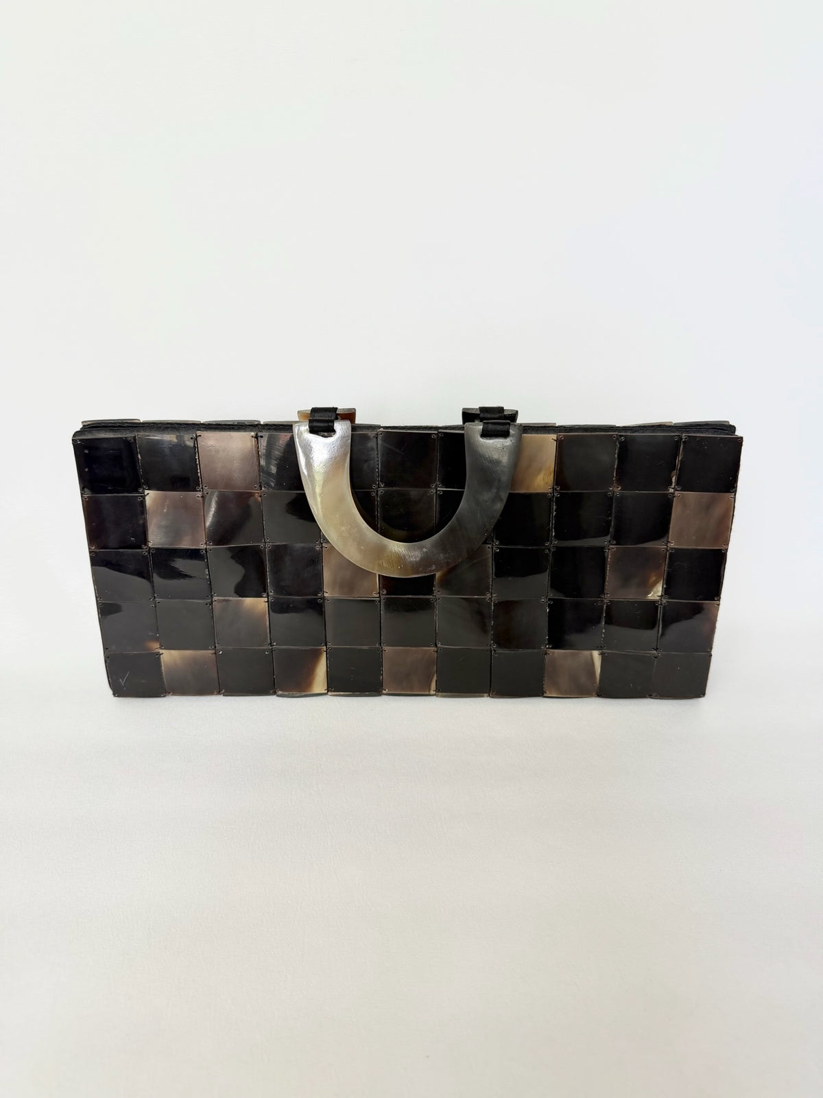 Vintage handled rectangular handbag with tortoise shell square tiles stitched together in a mosaic pattern. 