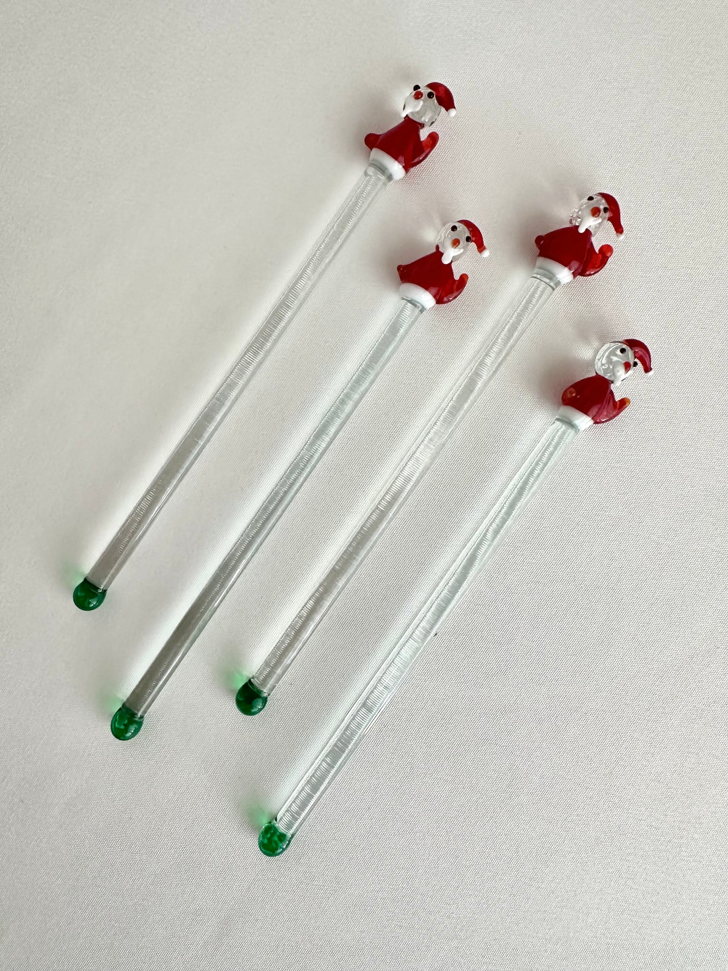 Glass Santa Claus drink stirrers set of four.