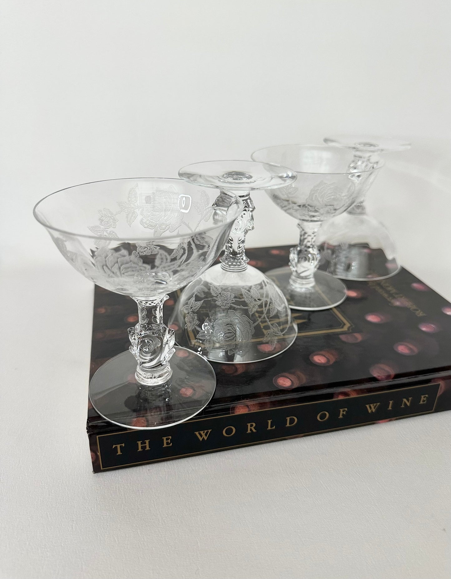 Vintage crystal rose stemmed and etched coupes set of four.