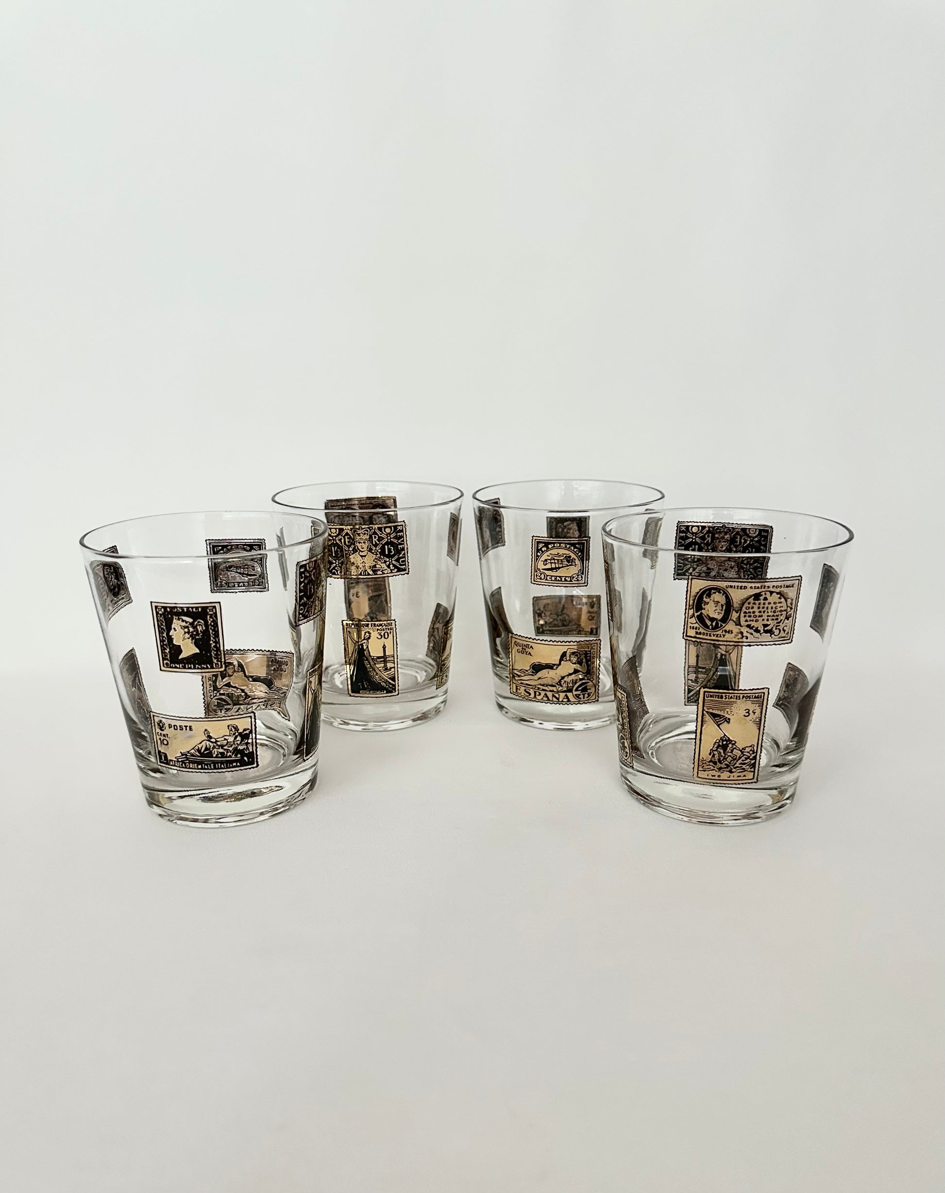 Vintage set of four double old fashioneds with black and gold stamp pattern.